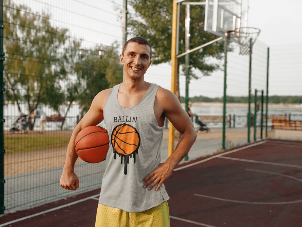 smiling young man at basketball court